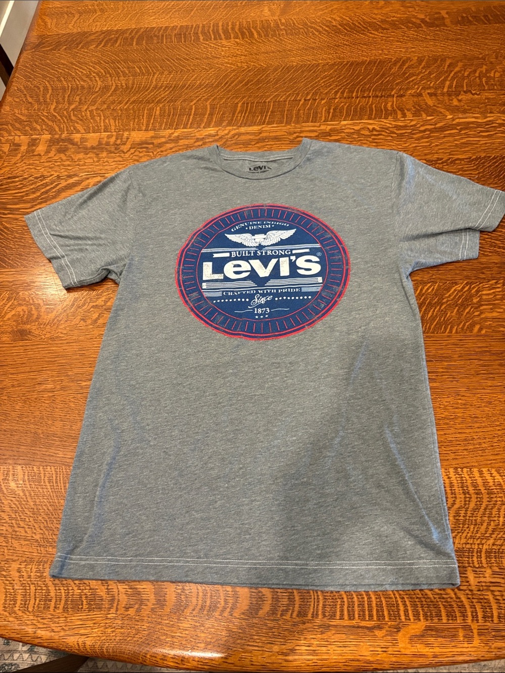 Levi's Men’s Medium Gray Tee with Navy and Red Distressed Logo.